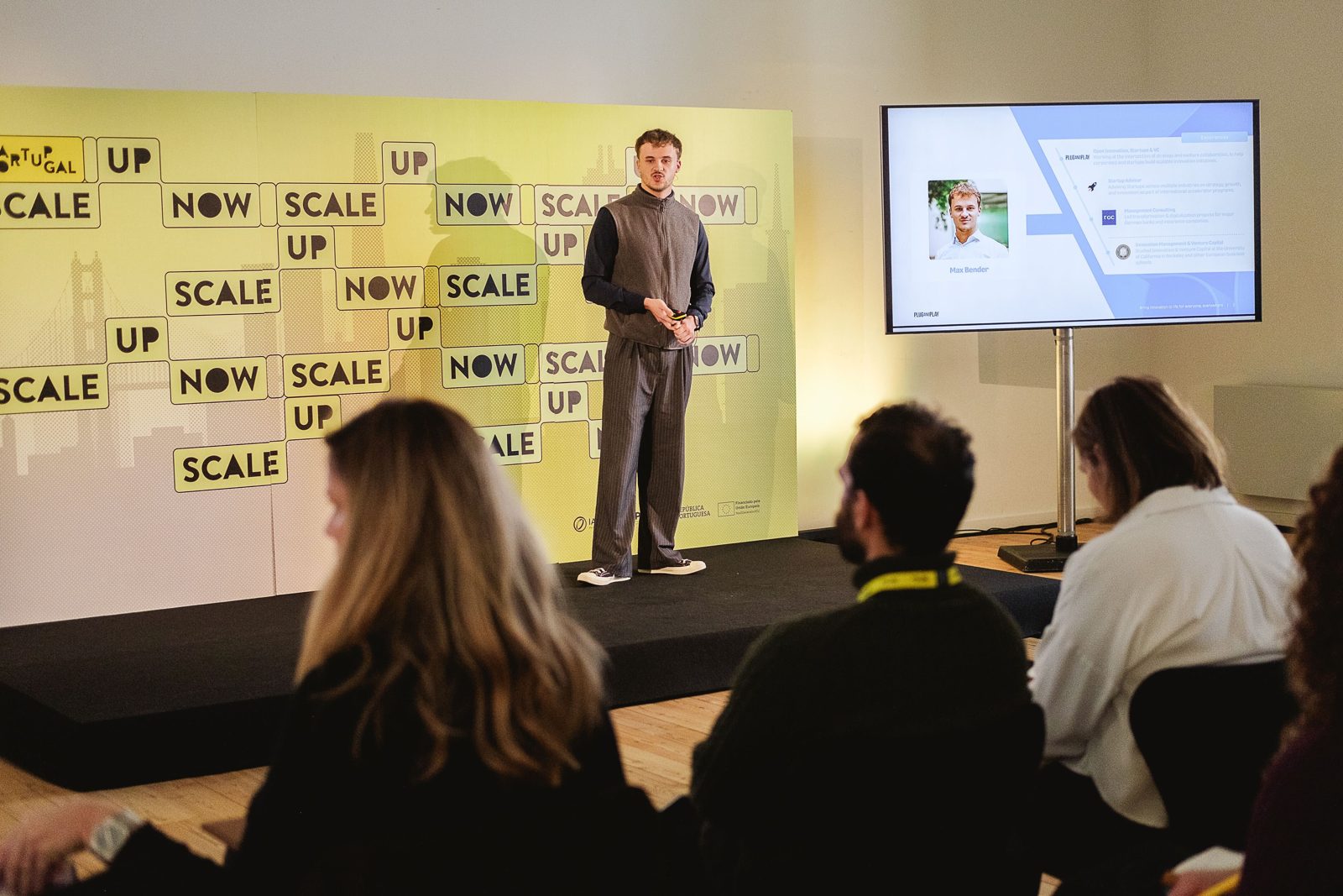 Max Bender on stage in Lisbon, talking to an audience of European founders